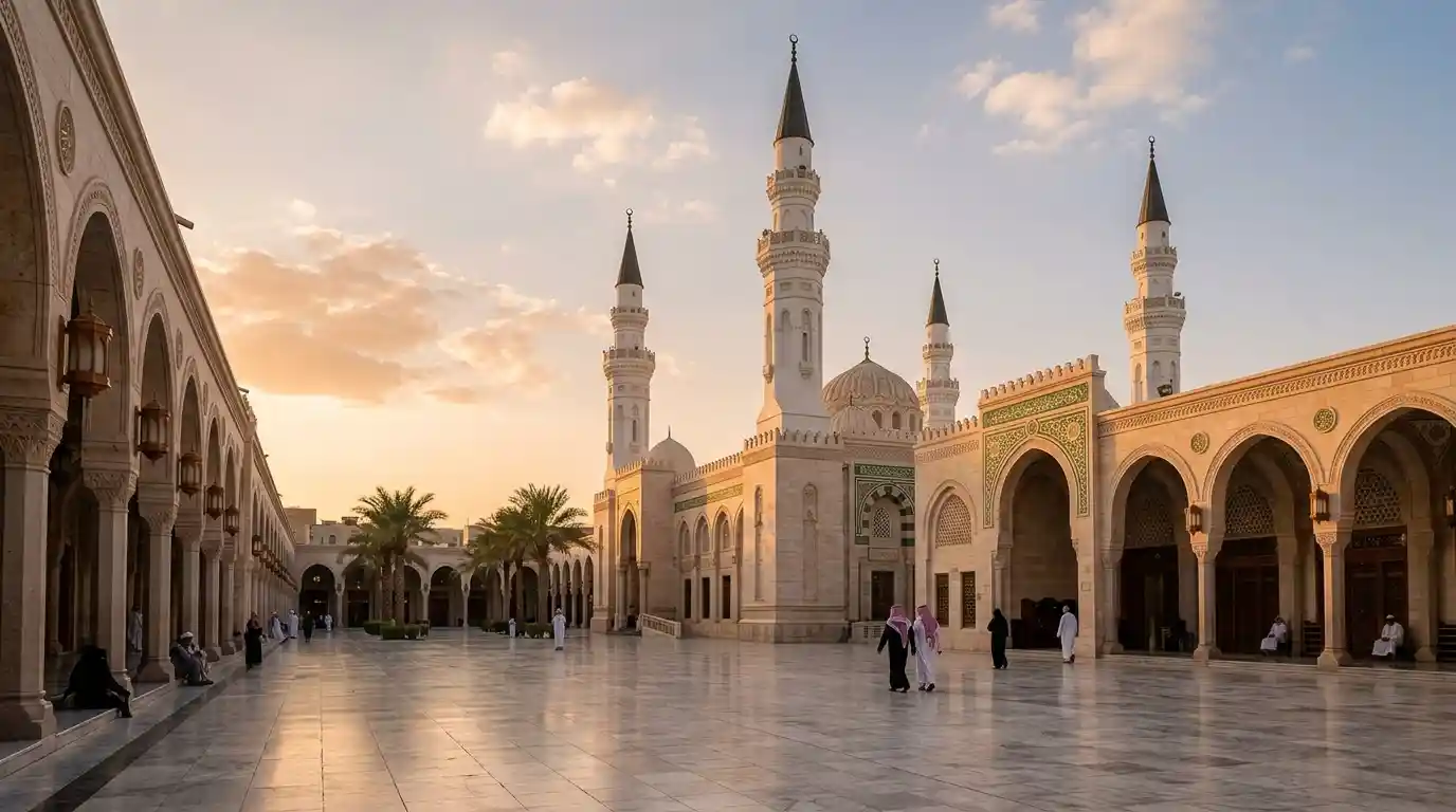 Traditional mosque architecture in Saudi Arabia beneath a warm golden-hour sky.