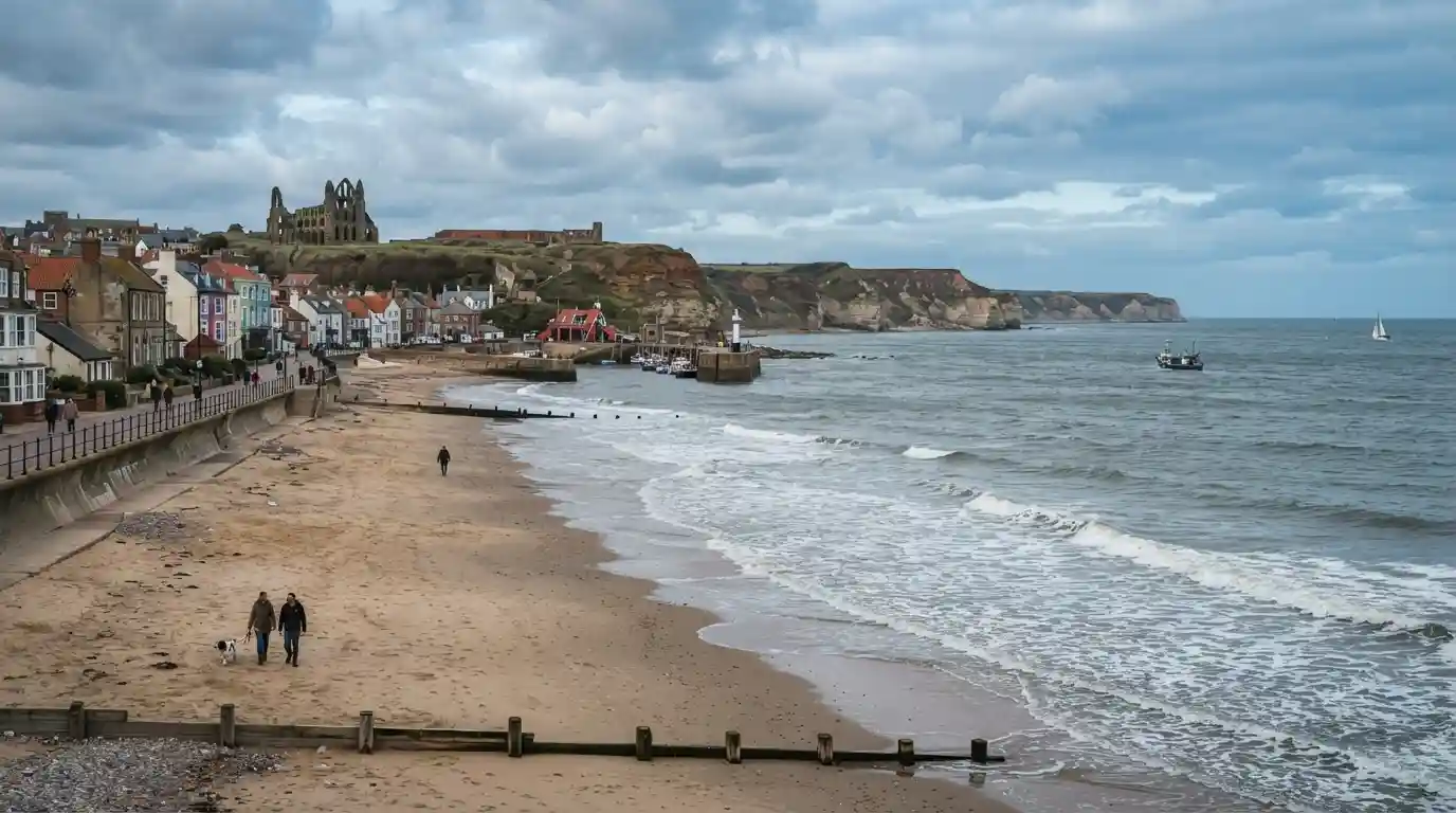 Scenic East Coast UK shoreline with a sandy beach, seaside town, and coastal cliffs